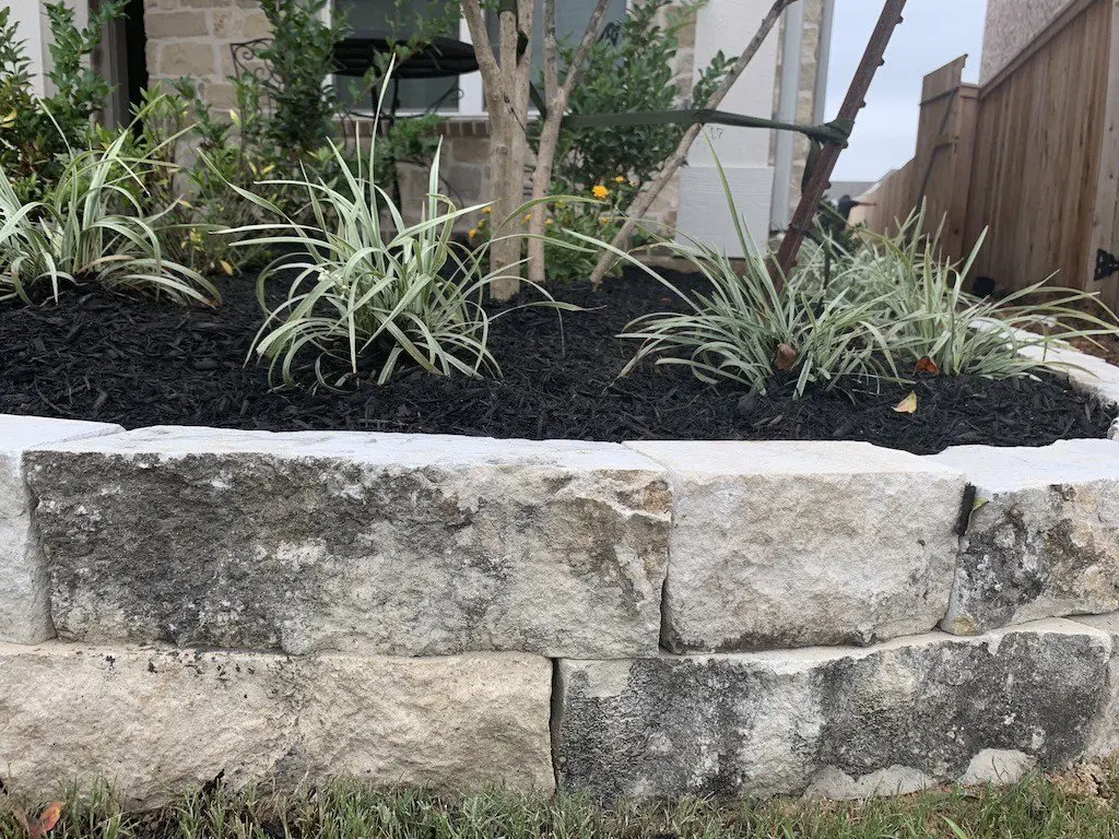 landscape edging double stacked chopped stone gray limestone houston tx 77407