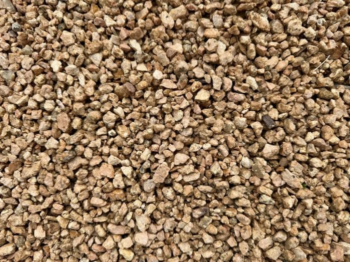 Bulk 3/8" crushed granite gravel in orange-brown tones for landscaping and driveways in Houston, TX