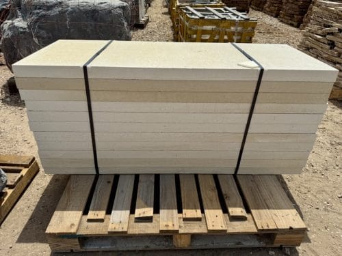 Lueders Limestone Slab Pavers in white cream color stacked on pallet for pickup or delivery in Houston, TX