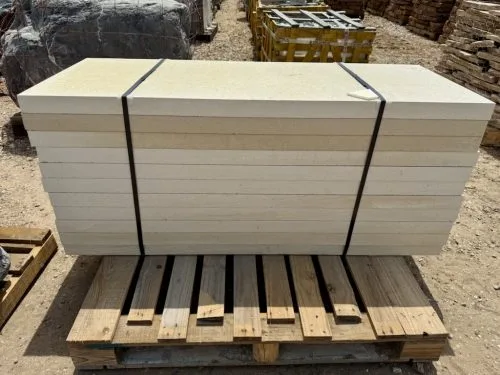 Lueders Limestone Slab Pavers in white cream color stacked on pallet for pickup or delivery in Houston, TX
